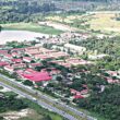 A stunning aerial drone view of Delta State, Nigeria, showing urban and rural economic activities