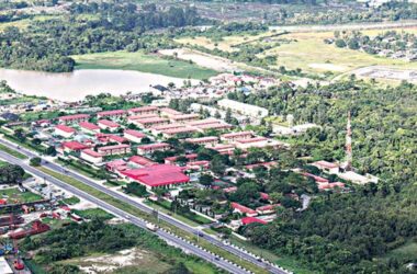 A stunning aerial drone view of Delta State, Nigeria, showing urban and rural economic activities