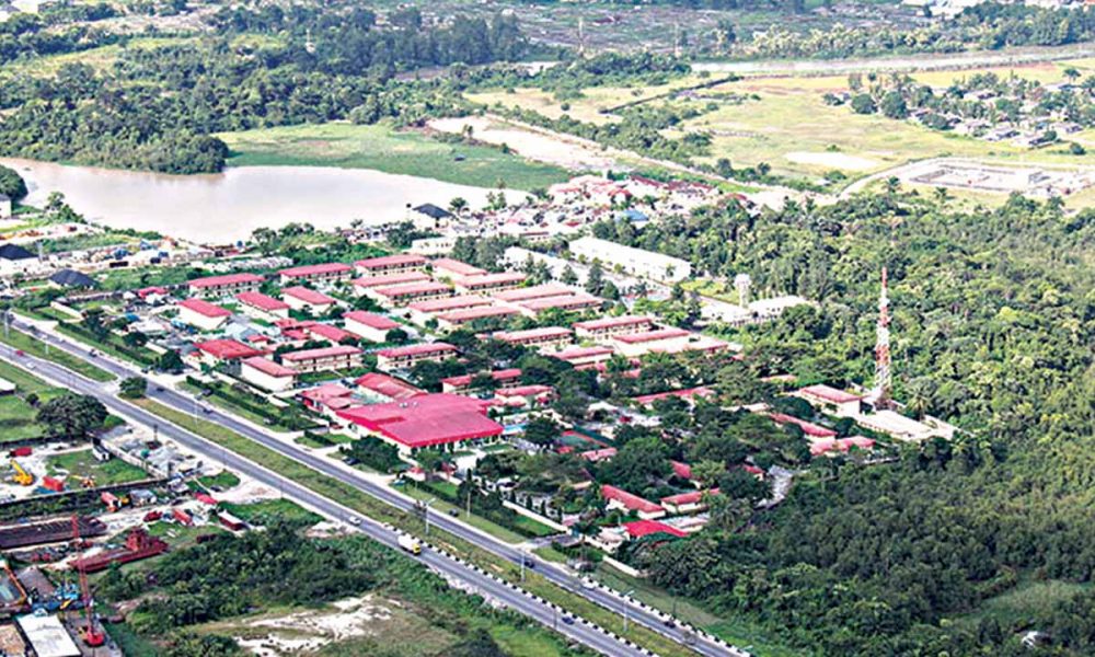 A stunning aerial drone view of Delta State, Nigeria, showing urban and rural economic activities
